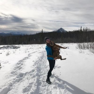 Hannah and her dog, Rocco enjoying a snowy hike!